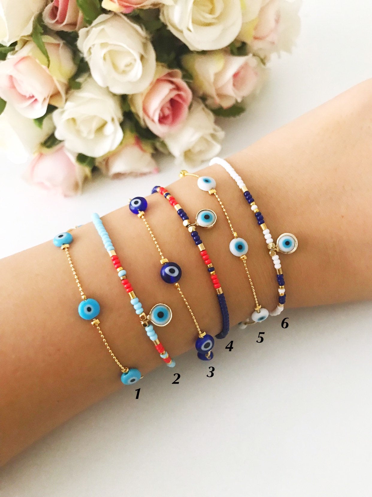 Handmade Evil Eye Bracelet featuring Miyuki seed beads in blue, turquoise, and white colors with an evil eye charm.