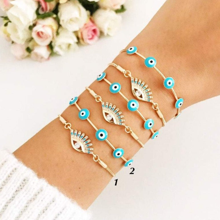 Adjustable Evil Eye Bracelet Set in gold with turquoise charm, showcasing handmade craftsmanship and stylish design.