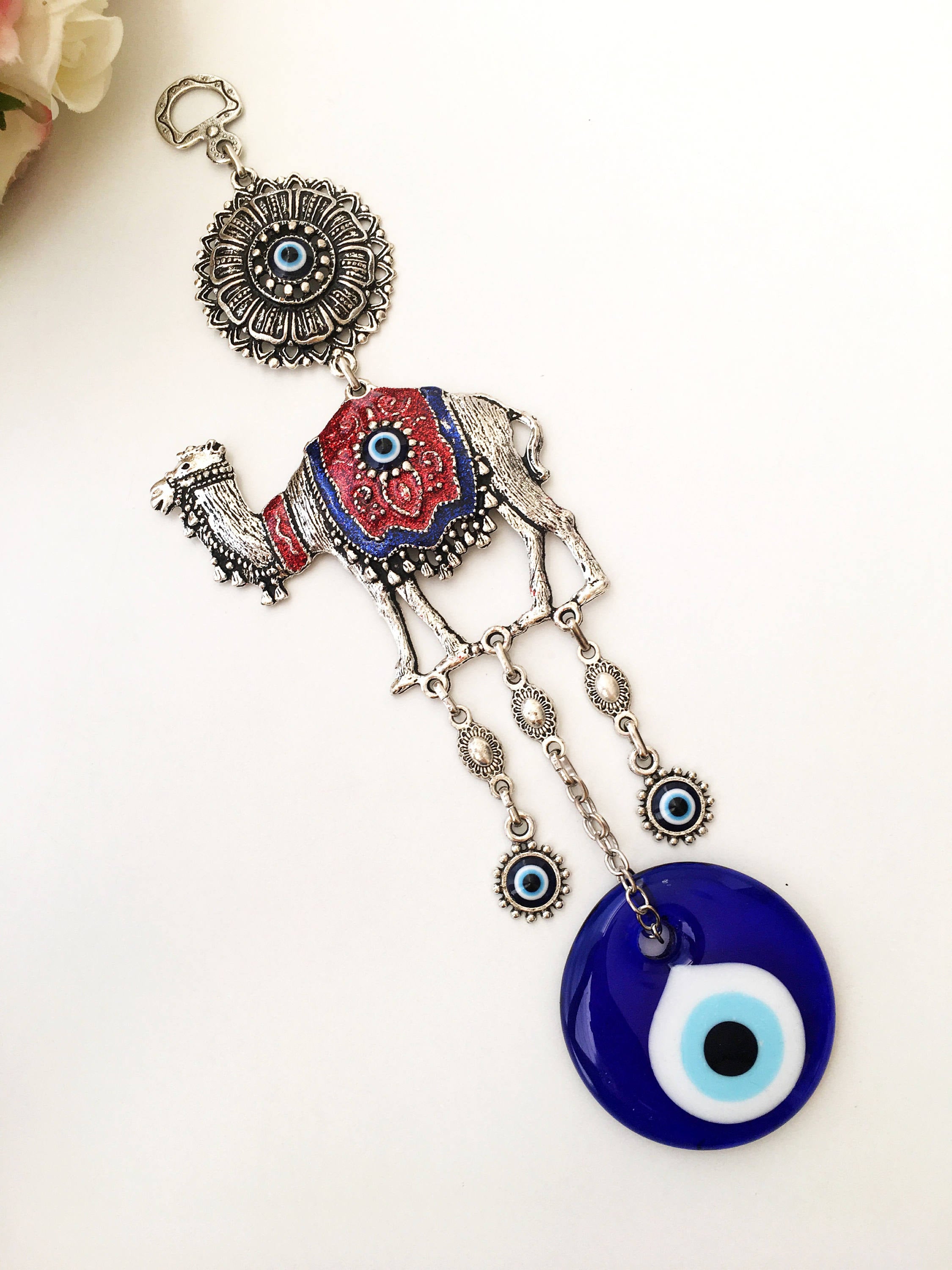 Handmade Evil Eye Camel Wall Hanging featuring traditional Turkish evil eye design in silver and red colors, symbolizing protection and good luck.