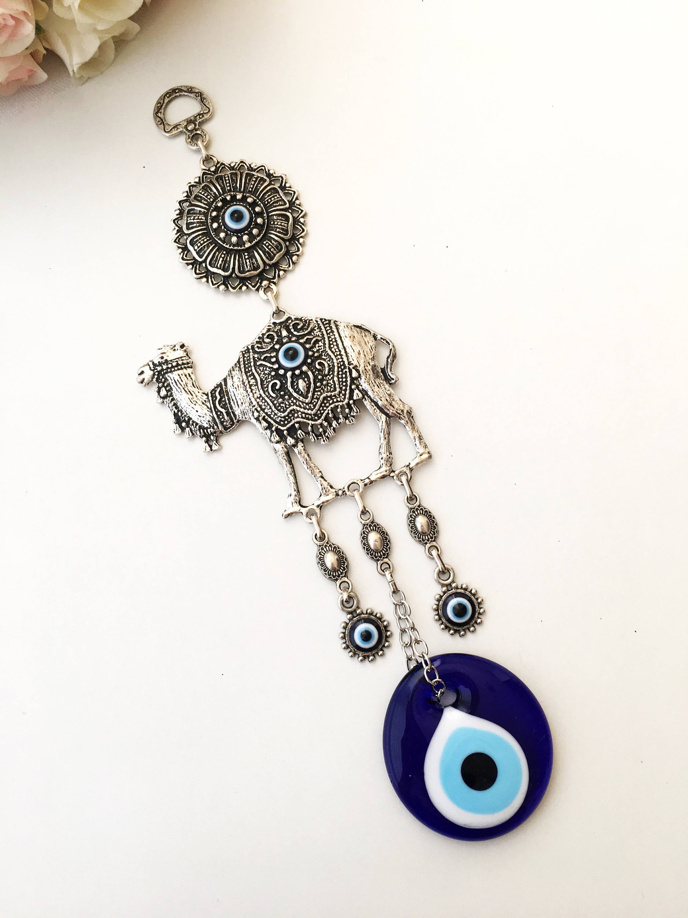 Handmade Evil Eye Camel Wall Hanging featuring traditional Turkish evil eye design in silver and red colors, symbolizing protection and good luck.