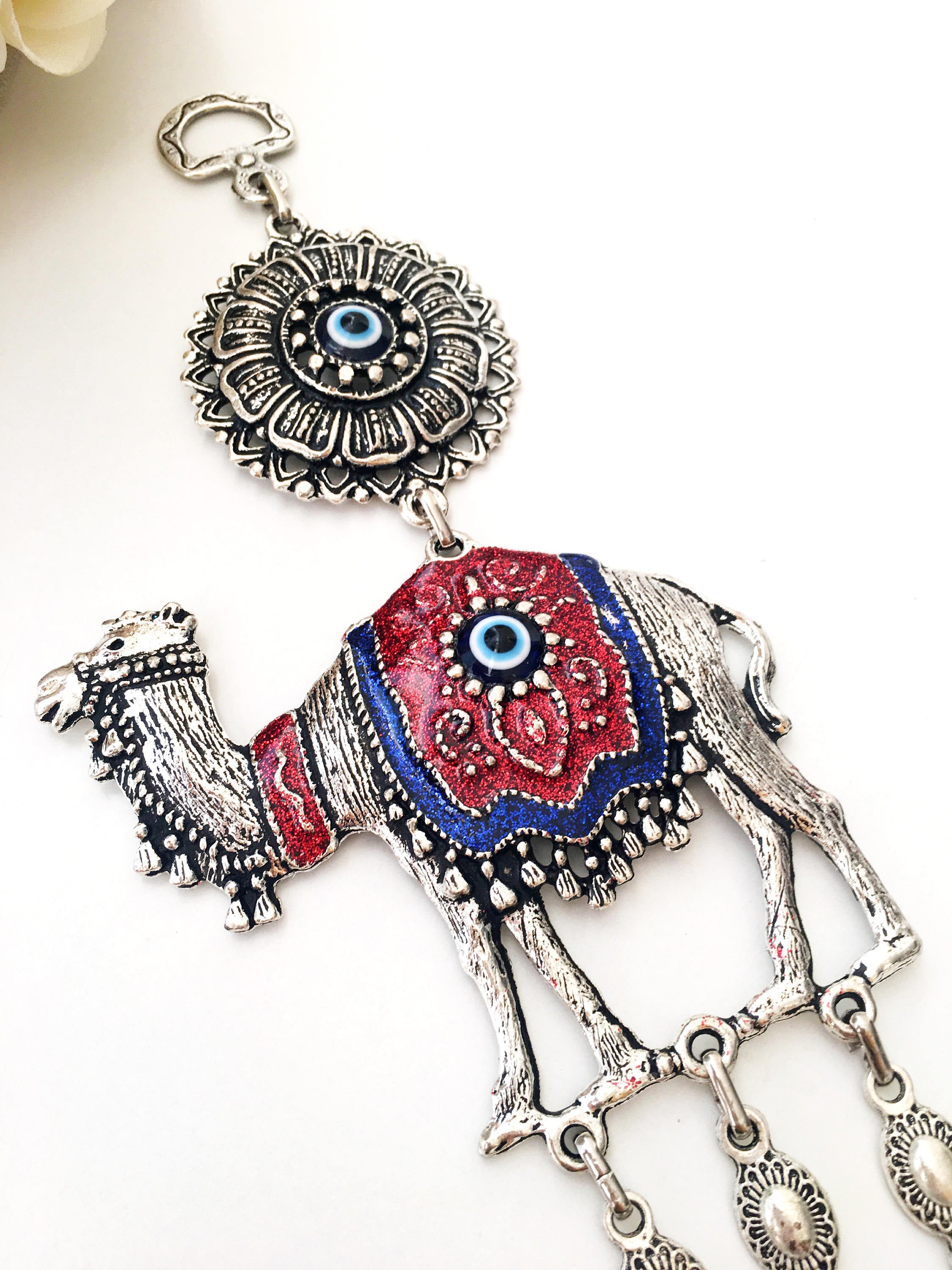 Handmade Evil Eye Camel Wall Hanging featuring traditional Turkish evil eye design in silver and red colors, symbolizing protection and good luck.