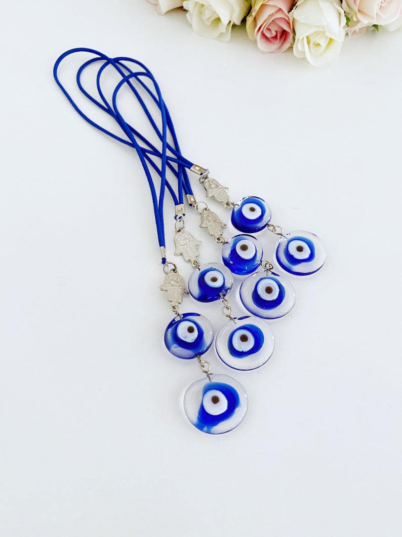 Evil Eye Car Mirror Charm featuring a silver hamsa hand and Murano glass evil eye, beautifully handmade for car protection.