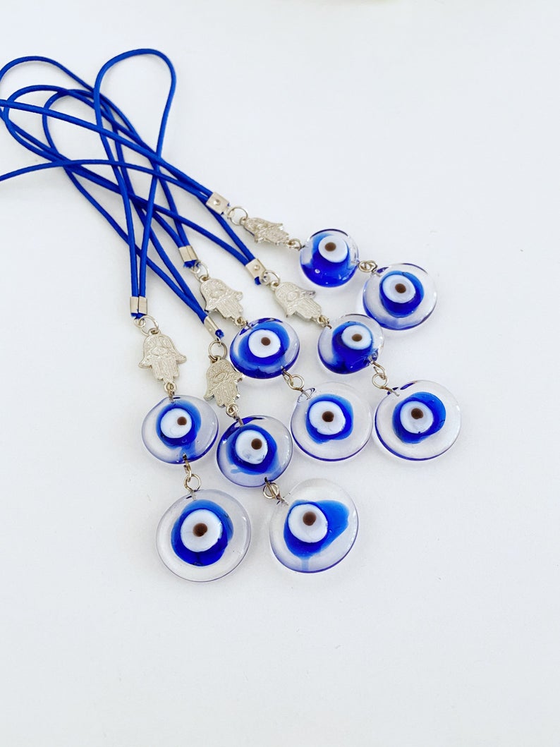 Evil Eye Car Mirror Charm featuring a silver hamsa hand and Murano glass evil eye, beautifully handmade for car protection.