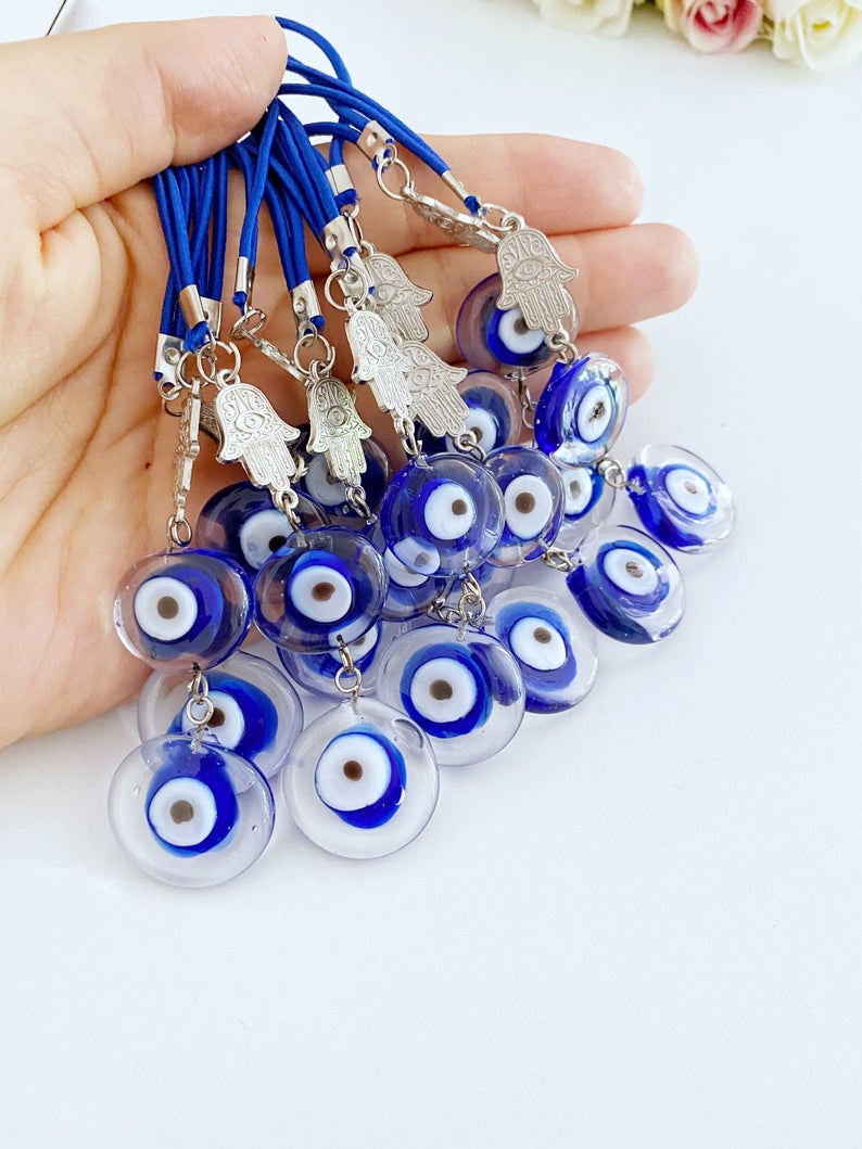 Evil Eye Car Mirror Charm featuring a silver hamsa hand and Murano glass evil eye, beautifully handmade for car protection.