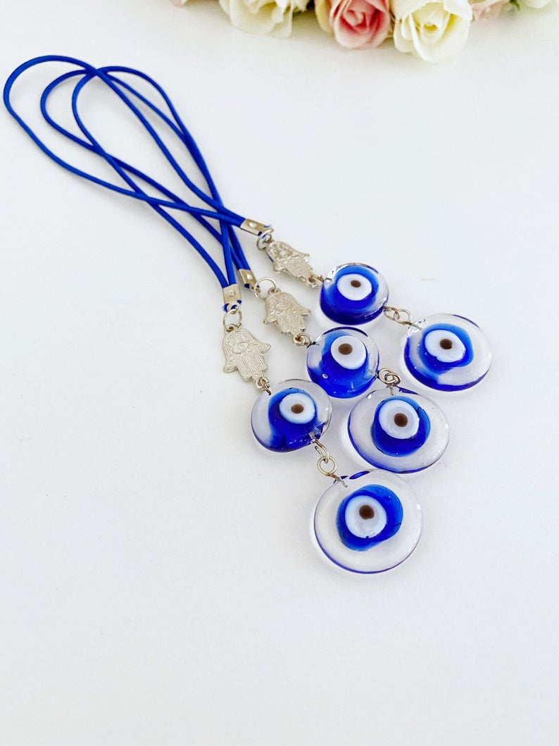 Evil Eye Car Mirror Charm featuring a silver hamsa hand and Murano glass evil eye, beautifully handmade for car protection.