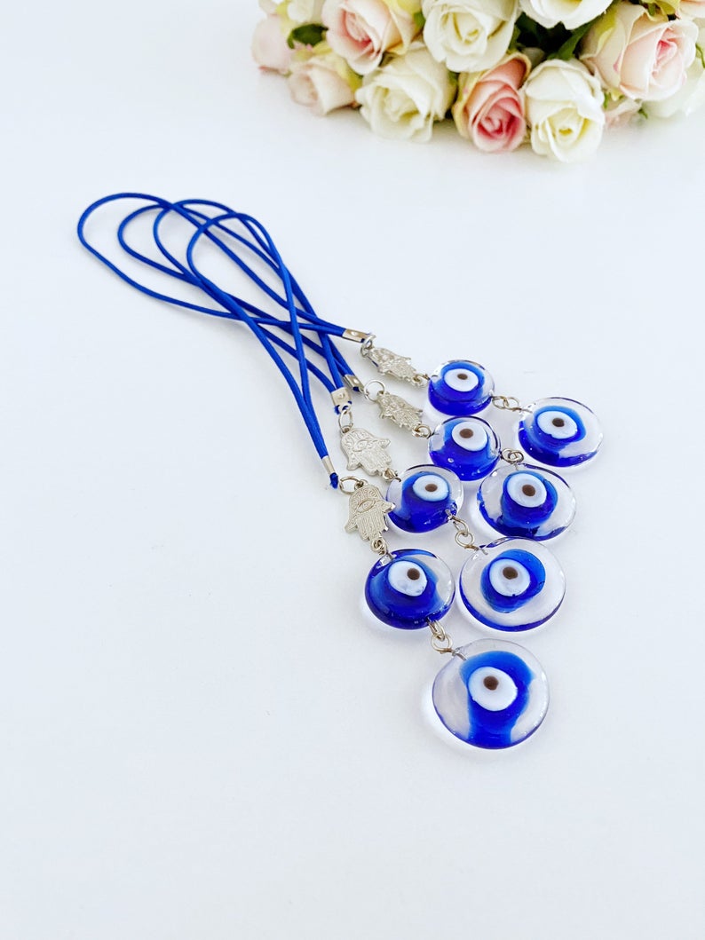 Evil Eye Car Mirror Charm featuring a silver hamsa hand and Murano glass evil eye, beautifully handmade for car protection.