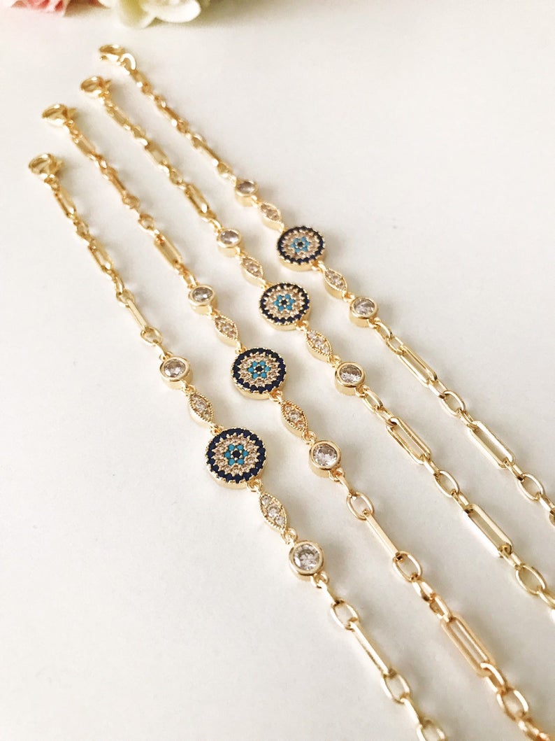 Elegant Evil Eye Chain Bracelet in rose gold and silver with zircon accents, featuring a blue evil eye charm.