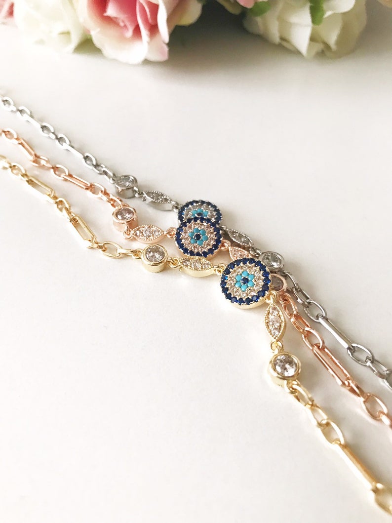 Elegant Evil Eye Chain Bracelet in rose gold and silver with zircon accents, featuring a blue evil eye charm.