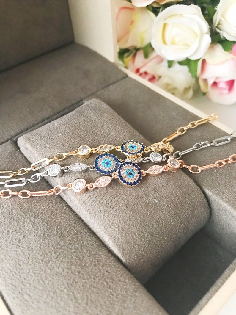 Elegant Evil Eye Chain Bracelet in rose gold and silver with zircon accents, featuring a blue evil eye charm.