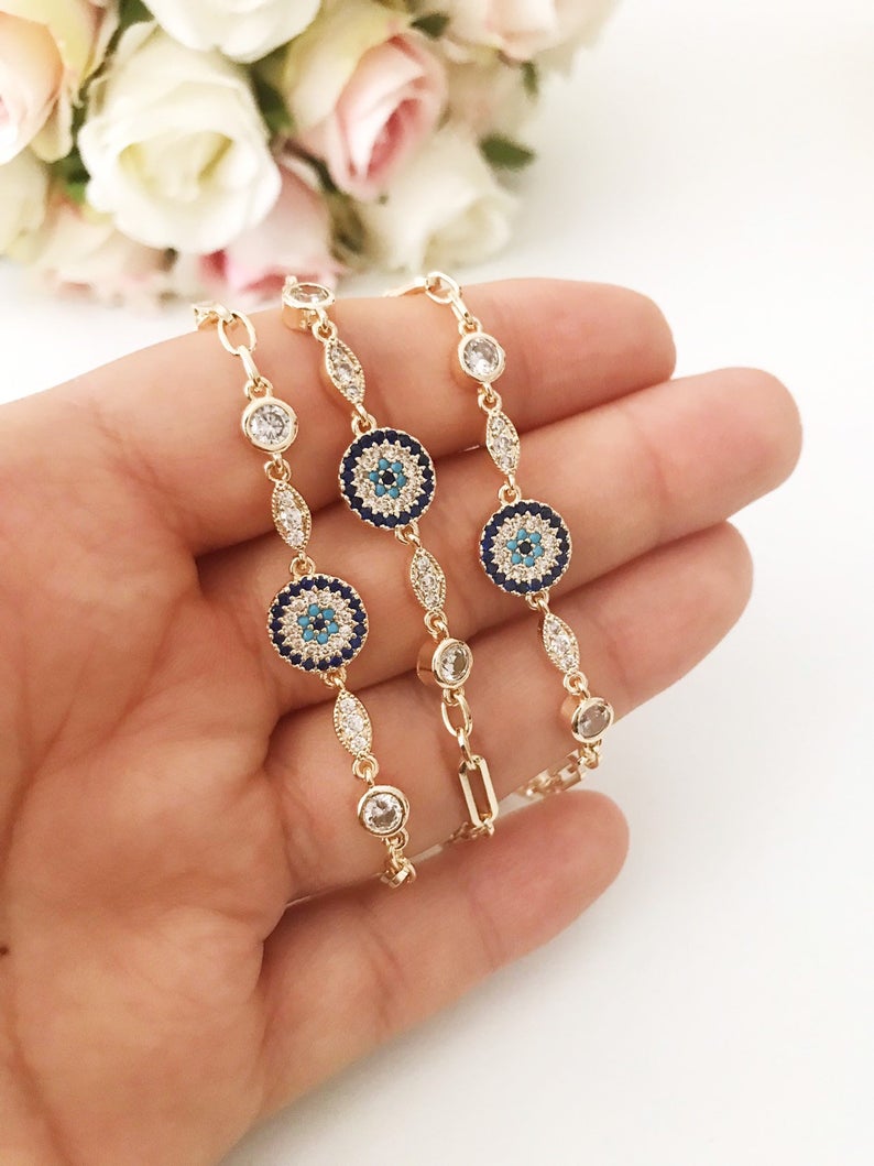 Elegant Evil Eye Chain Bracelet in rose gold and silver with zircon accents, featuring a blue evil eye charm.