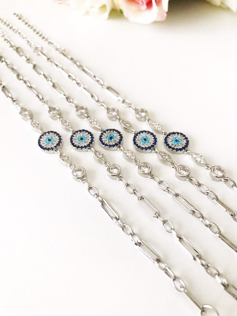 Elegant Evil Eye Chain Bracelet in rose gold and silver with zircon accents, featuring a blue evil eye charm.