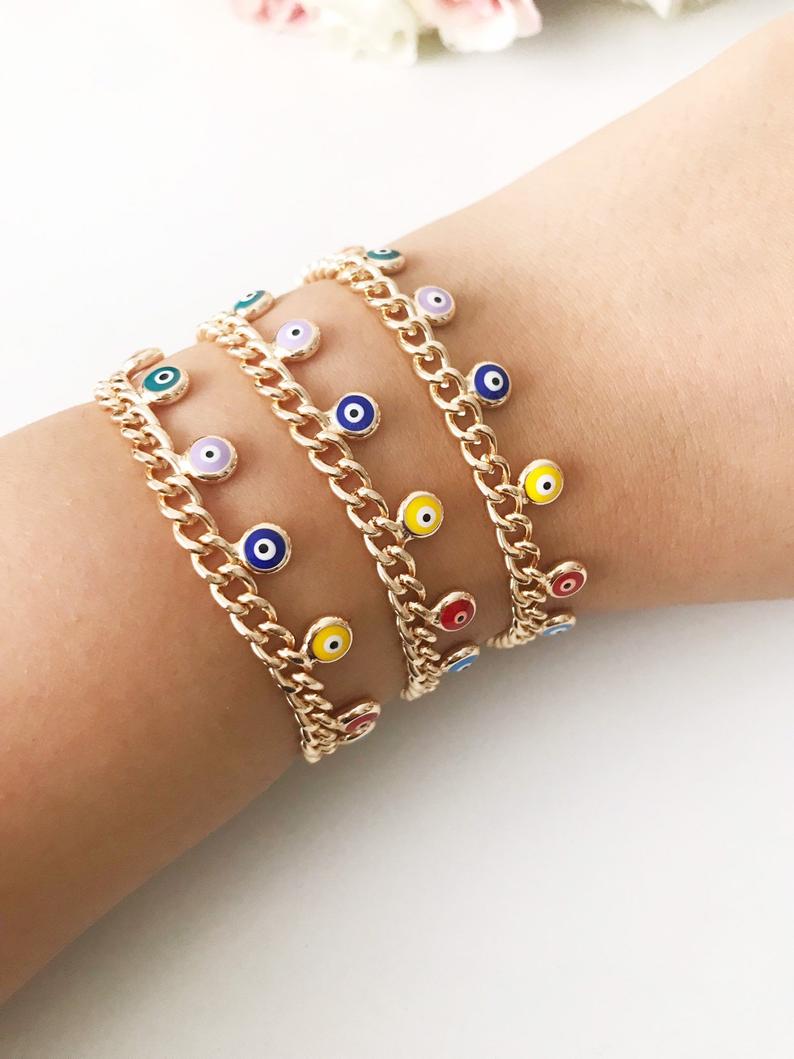 A beautiful rose gold chain bracelet featuring a colorful evil eye charm, symbolizing protection and good luck.