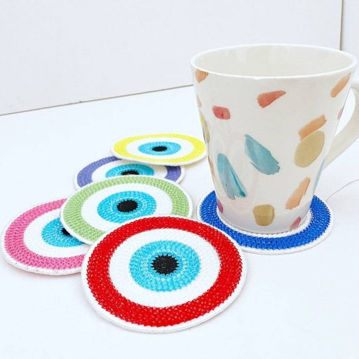 Set of 4 handmade Evil Eye coasters featuring vibrant colors and intricate designs, perfect for home decor and protection.