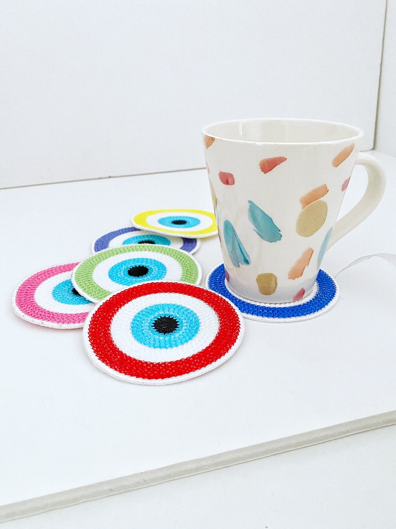 Set of 4 handmade Evil Eye coasters featuring vibrant colors and intricate designs, perfect for home decor and protection.