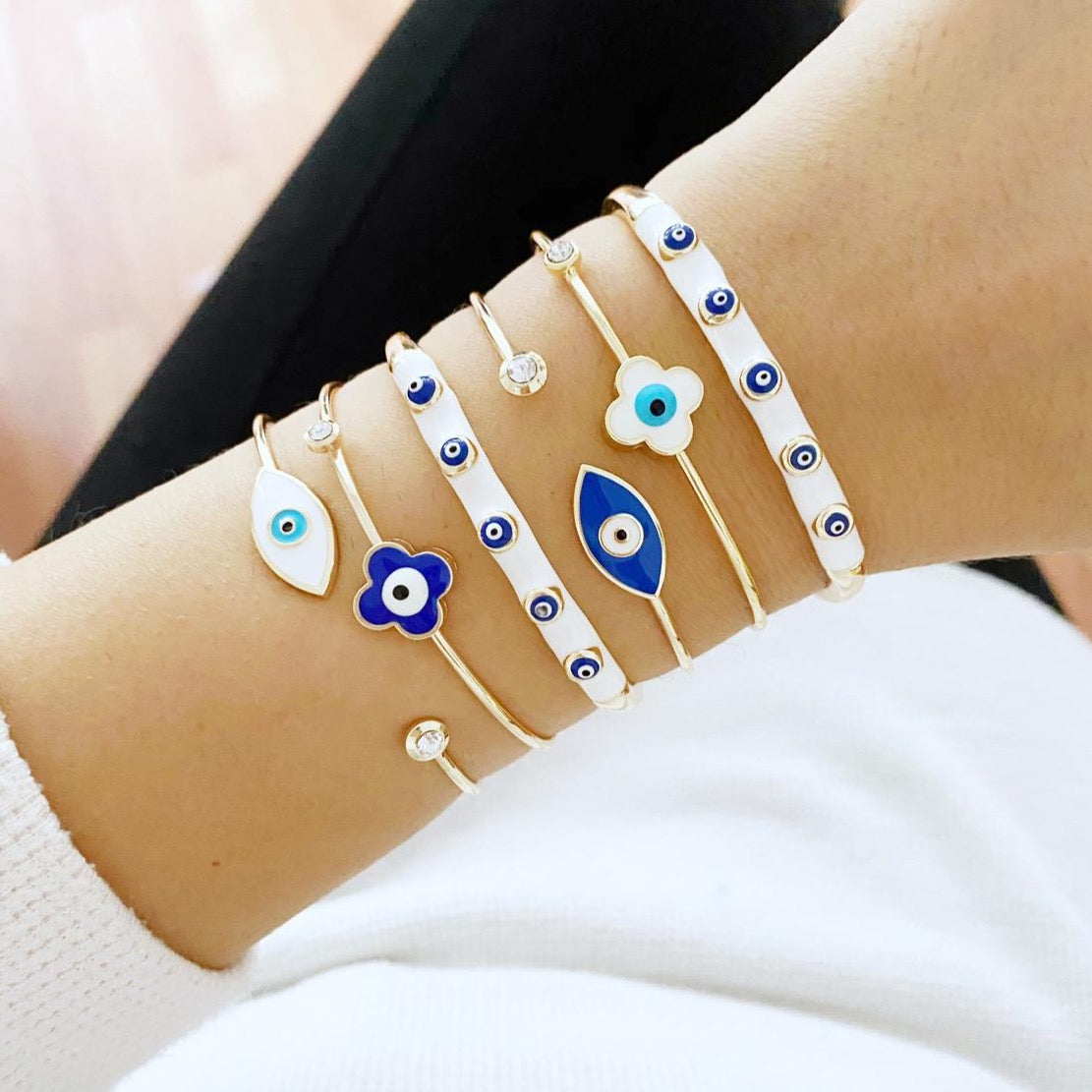 Elegant Evil Eye Cuff Bracelet in gold, featuring a protective blue evil eye bead and stylish design.