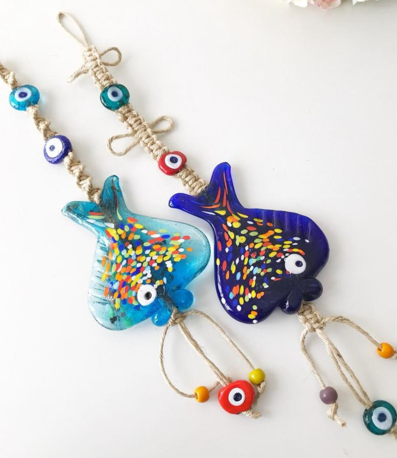 Handmade Evil Eye Fish Wall Hanging featuring vibrant glass fish and evil eye beads in turquoise and dark blue colors.