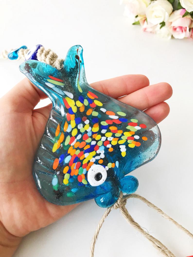 Handmade Evil Eye Fish Wall Hanging featuring vibrant glass fish and evil eye beads in turquoise and dark blue colors.