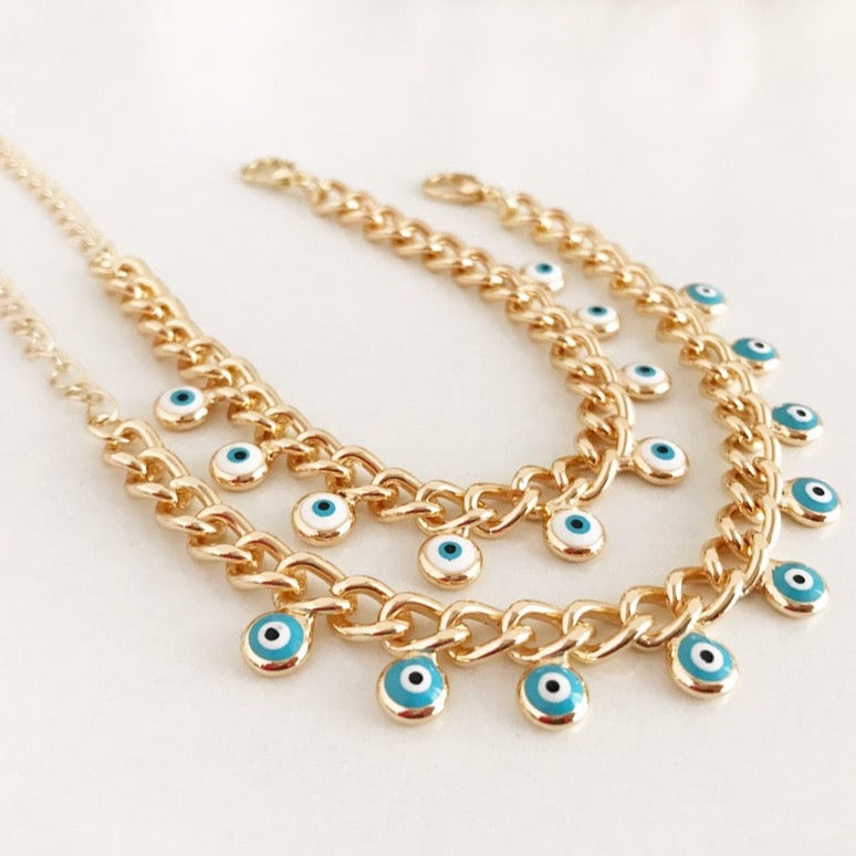 Evil Eye Gold Chain Bracelet featuring blue and white beads with a gold chain, showcasing a 10mm evil eye charm.