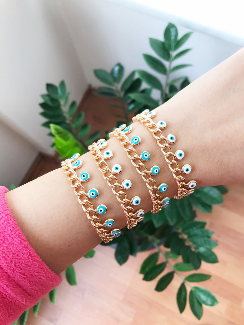 Evil Eye Gold Chain Bracelet featuring blue and white beads with a gold chain, showcasing a 10mm evil eye charm.