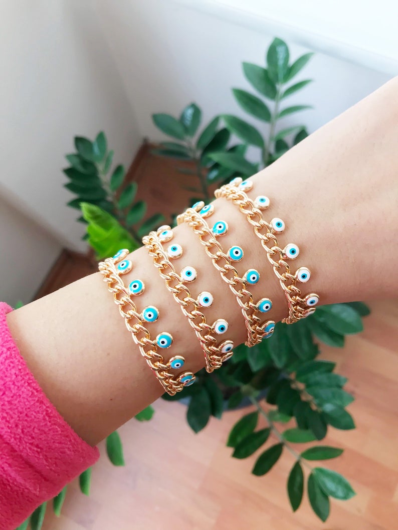 Evil Eye Gold Chain Bracelet featuring blue and white beads with a gold chain, showcasing a 10mm evil eye charm.