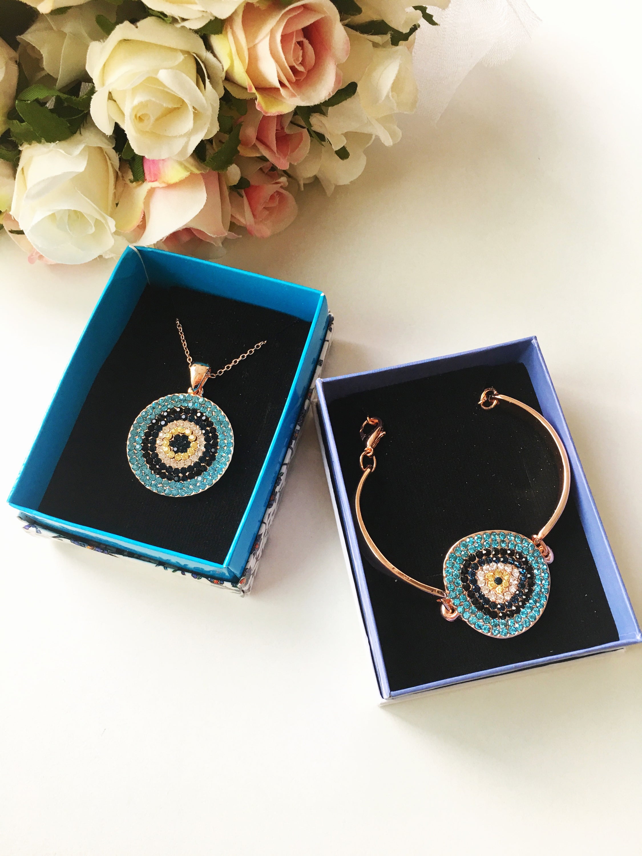 Evil Eye Jewelry Gift Set featuring a zircon bracelet and necklace in rose gold, elegantly displayed in a gift box.