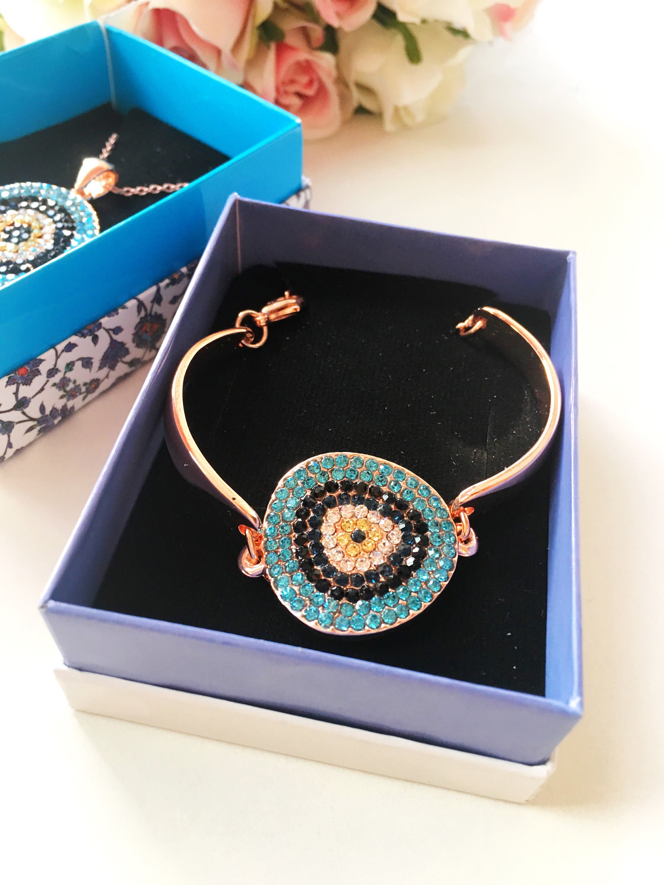 Evil Eye Jewelry Gift Set featuring a zircon bracelet and necklace in rose gold, elegantly displayed in a gift box.