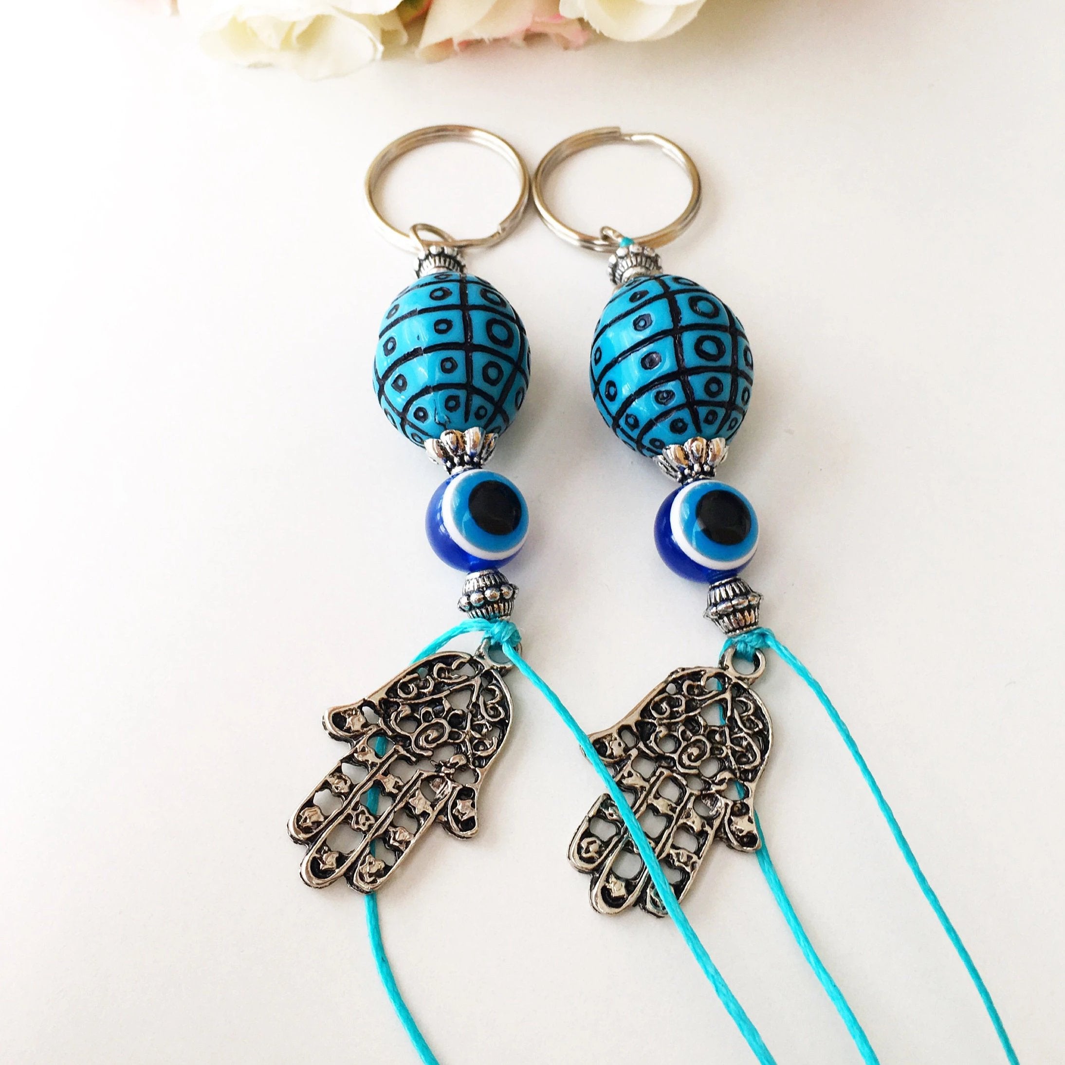 A beautiful Evil Eye keychain featuring a turquoise design, symbolizing protection and luck, perfect for bags or keys.