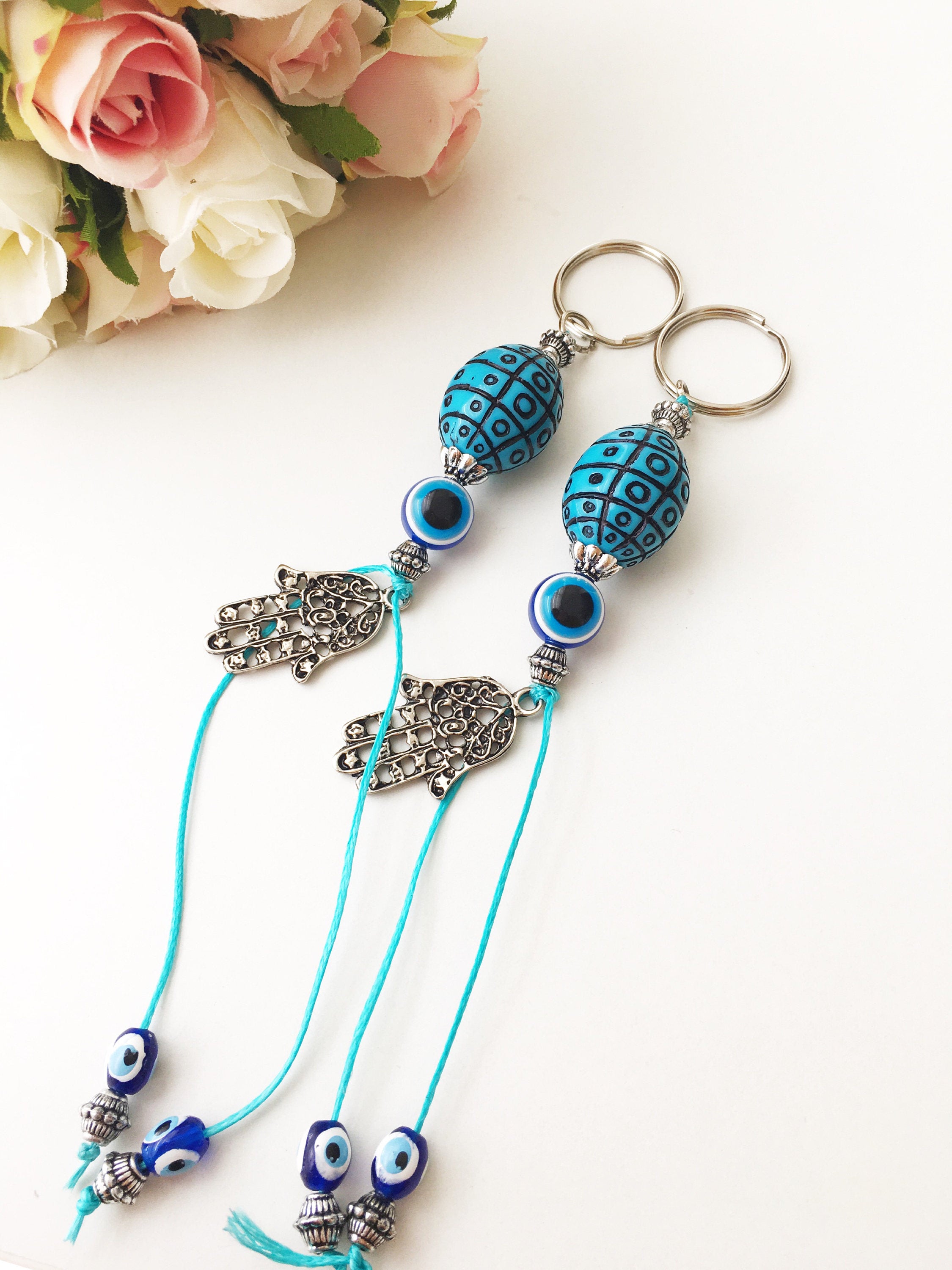 A beautiful Evil Eye keychain featuring a turquoise design, symbolizing protection and luck, perfect for bags or keys.