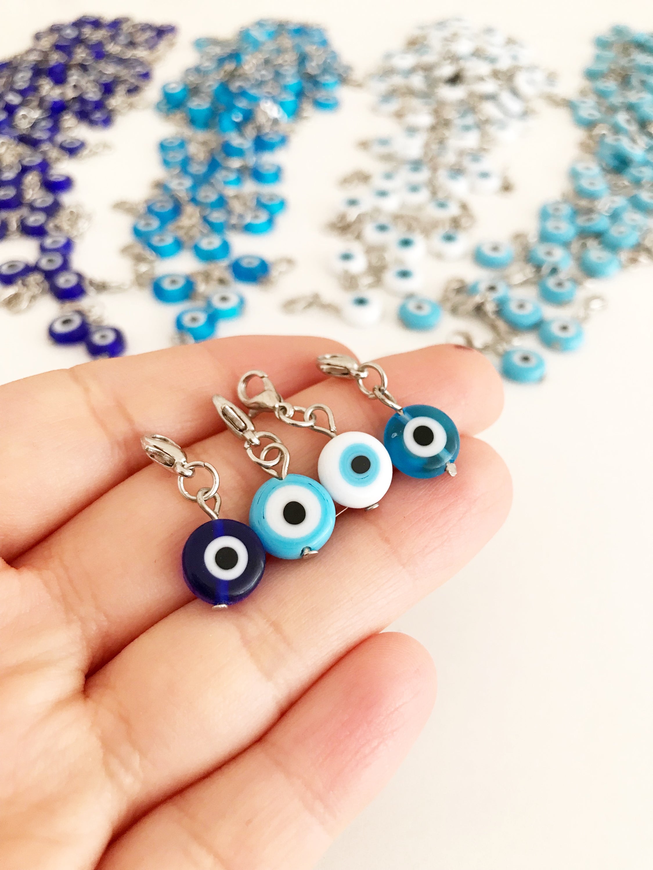 Set of 5 Evil Eye Keychain Charms featuring blue glass beads and lobster clasps, designed for protection and style.