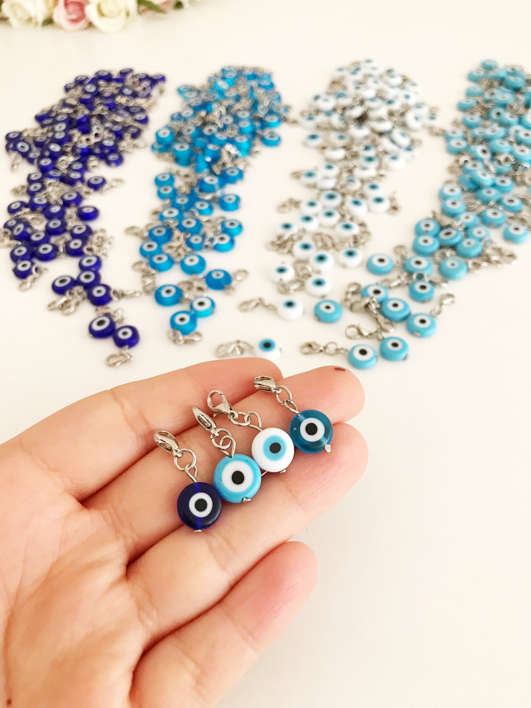 Set of 5 Evil Eye Keychain Charms featuring blue glass beads and lobster clasps, designed for protection and style.