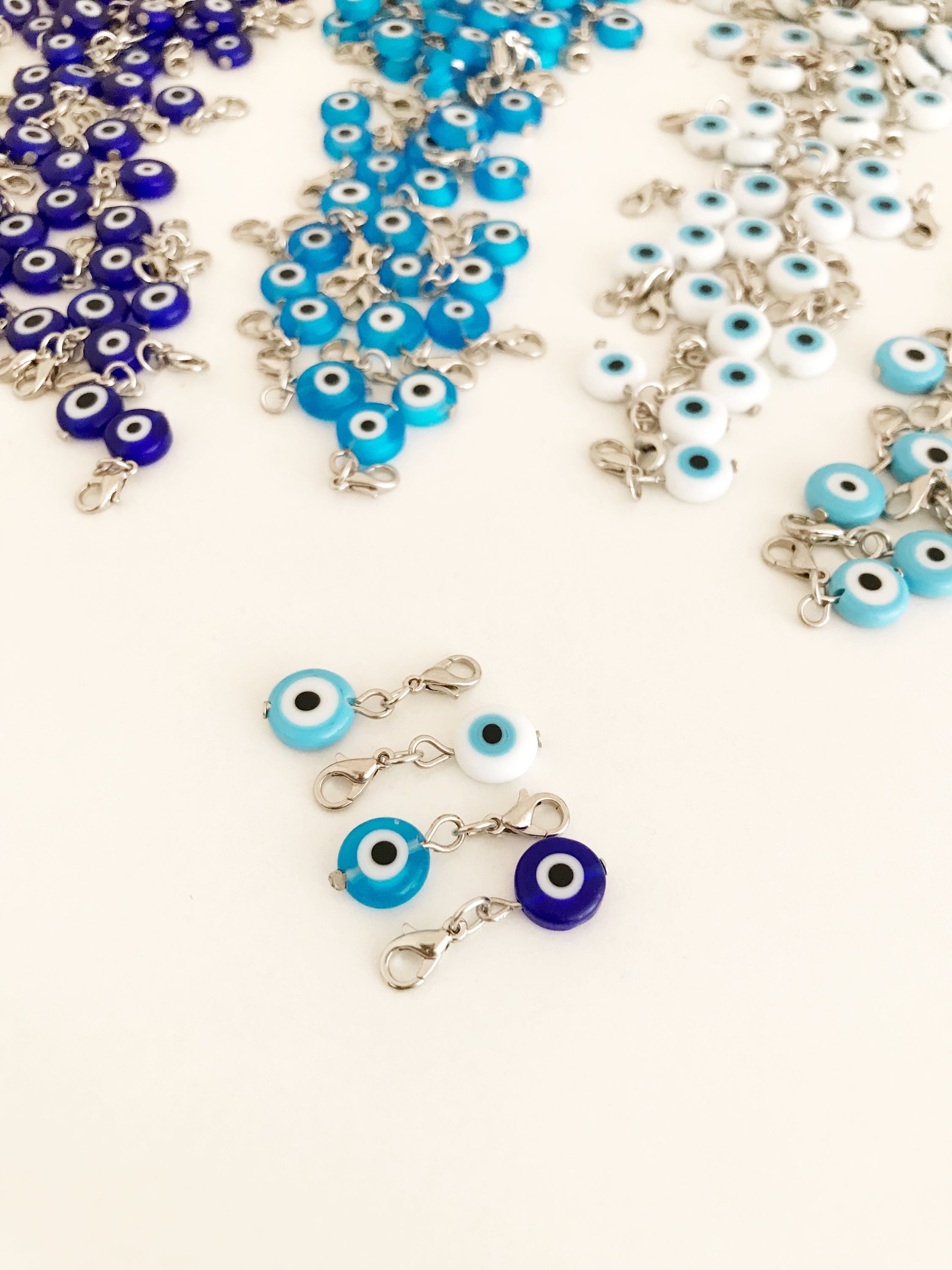 Set of 5 Evil Eye Keychain Charms featuring blue glass beads and lobster clasps, designed for protection and style.