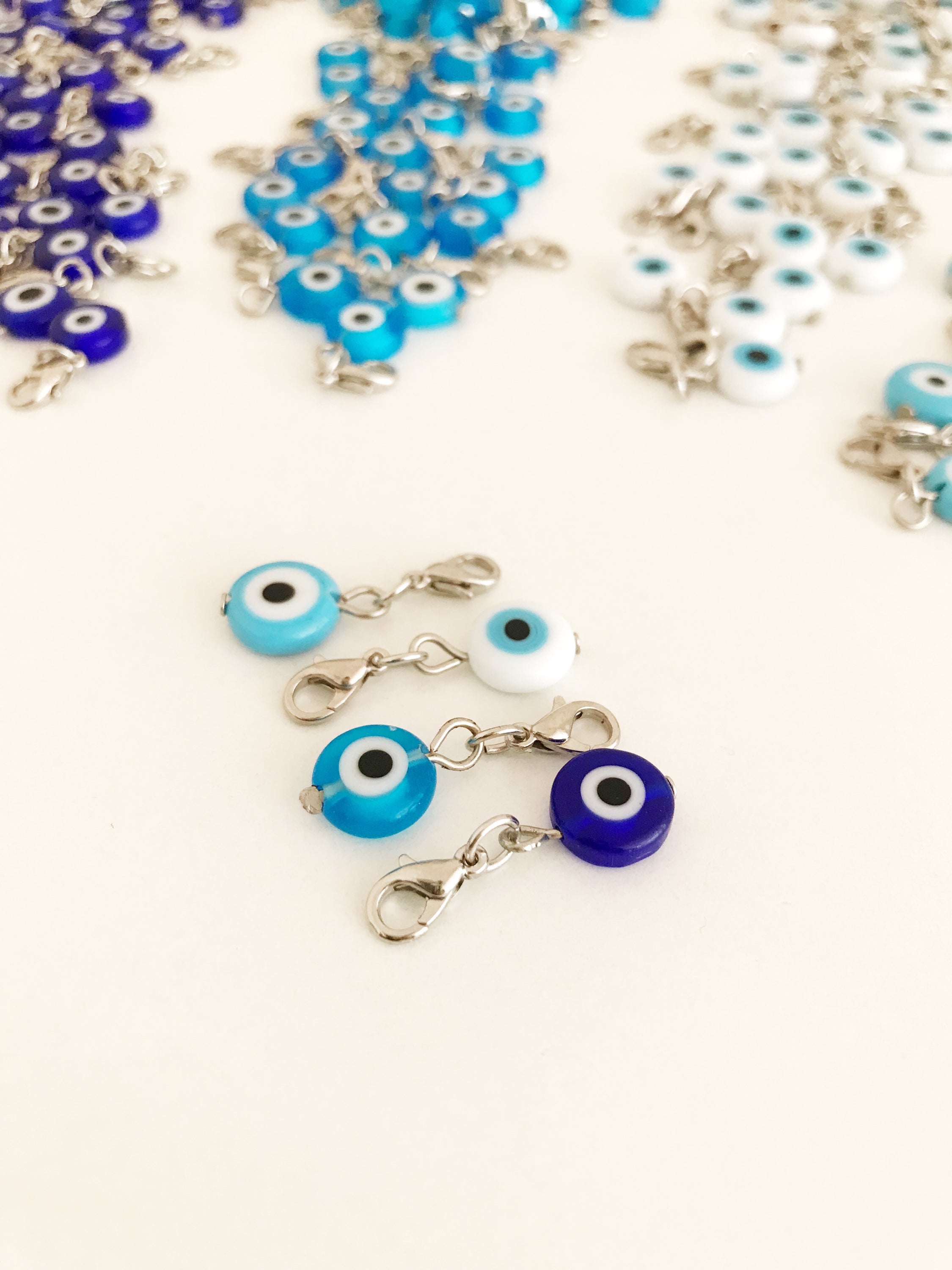 Set of 5 Evil Eye Keychain Charms featuring blue glass beads and lobster clasps, designed for protection and style.