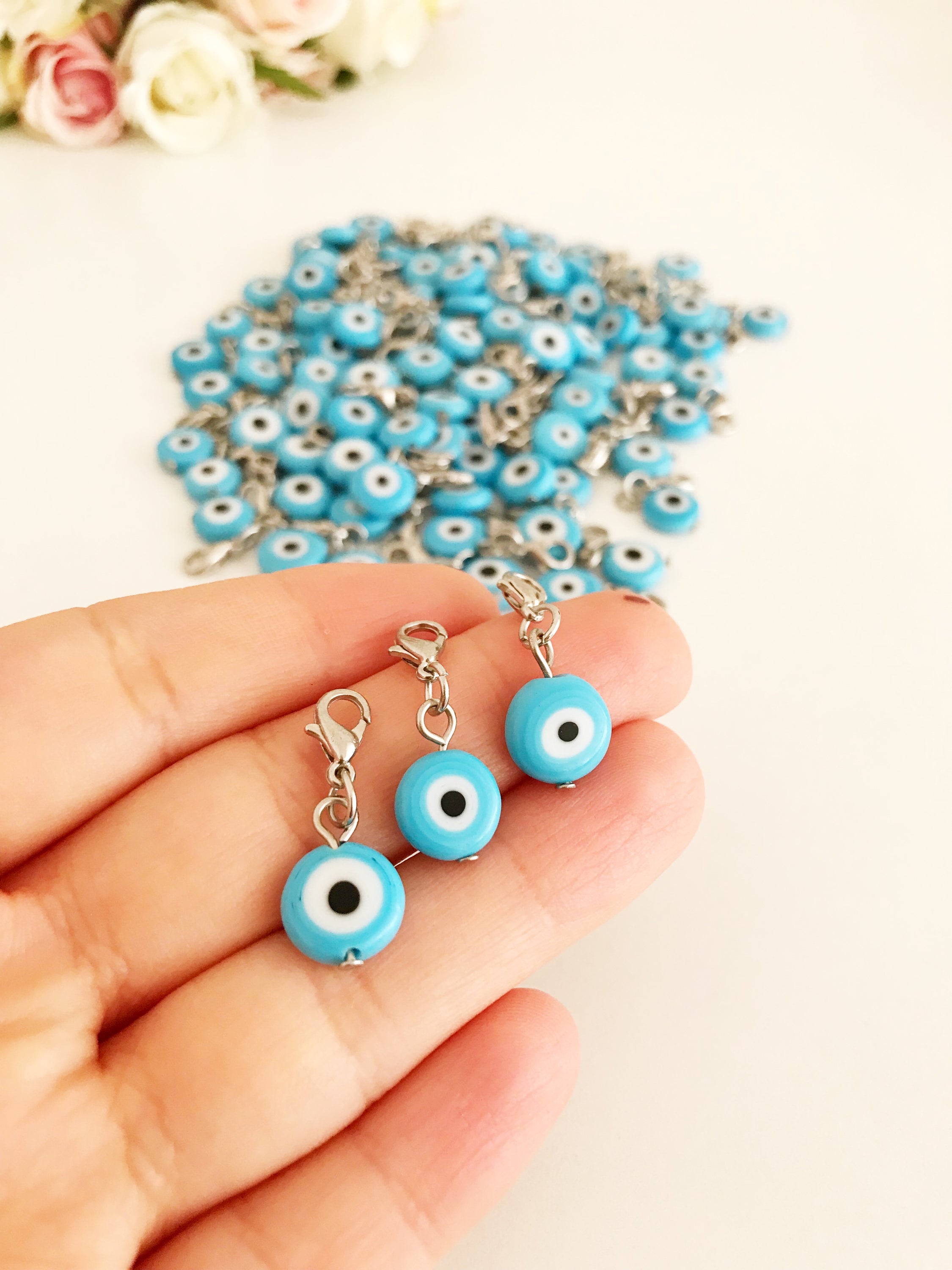 Set of 5 Evil Eye Keychain Charms featuring blue glass beads and lobster clasps, designed for protection and style.