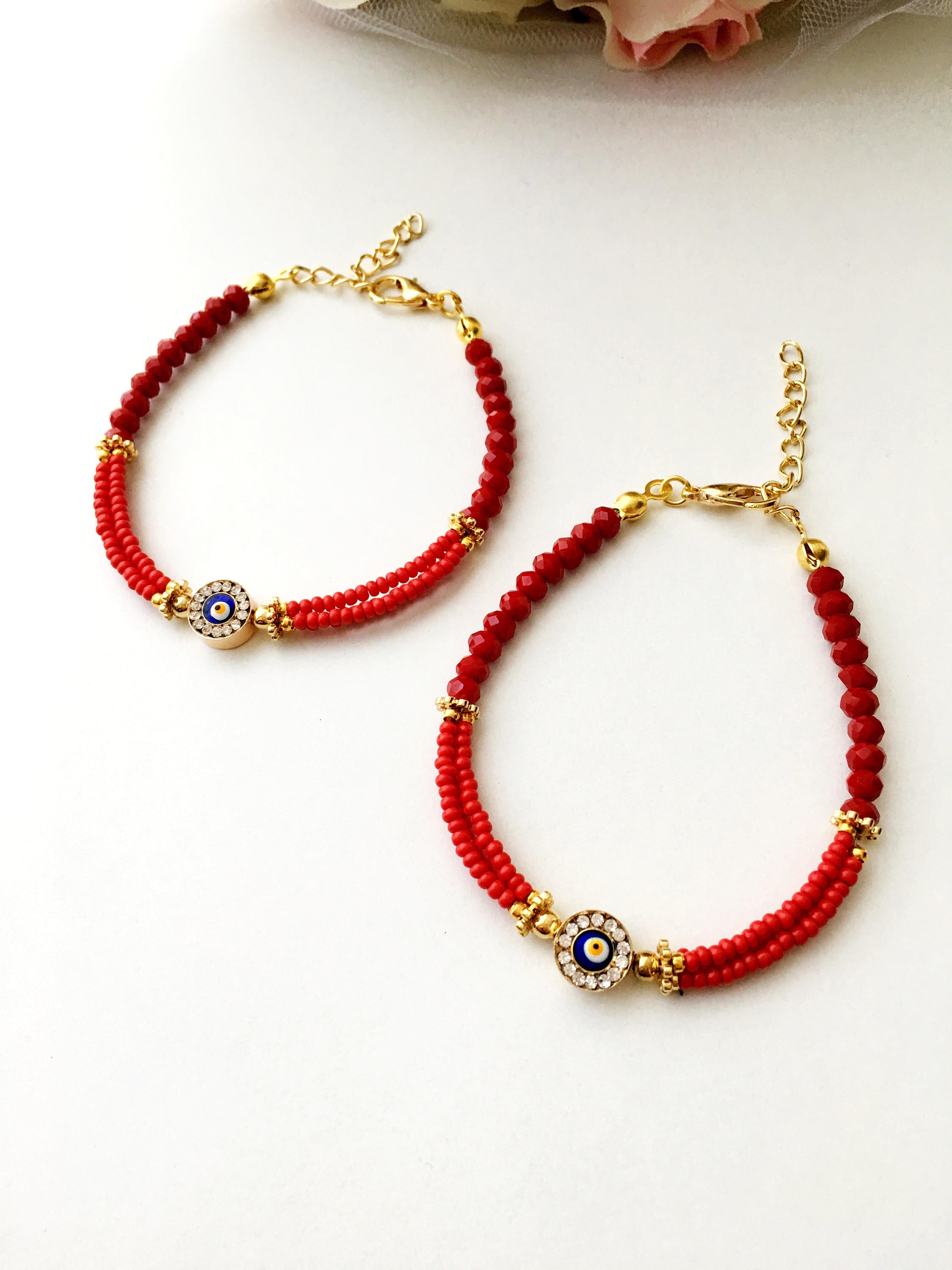 Handmade Evil Eye Miyuki Bracelet featuring vibrant seed beads in turquoise, dark blue, red, green, and creamy colors with an evil eye charm.