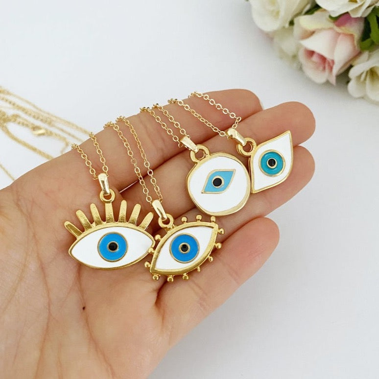 Handmade Evil Eye Necklace featuring a white evil eye bead and gold accents, eye-shaped charm, adjustable length.