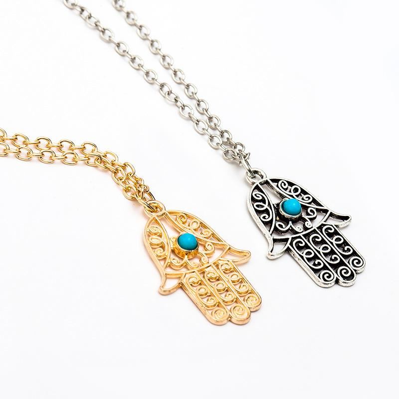 Evil Eye Pendant featuring Hamsa design, symbolizing protection and good luck, elegantly crafted with vibrant colors.