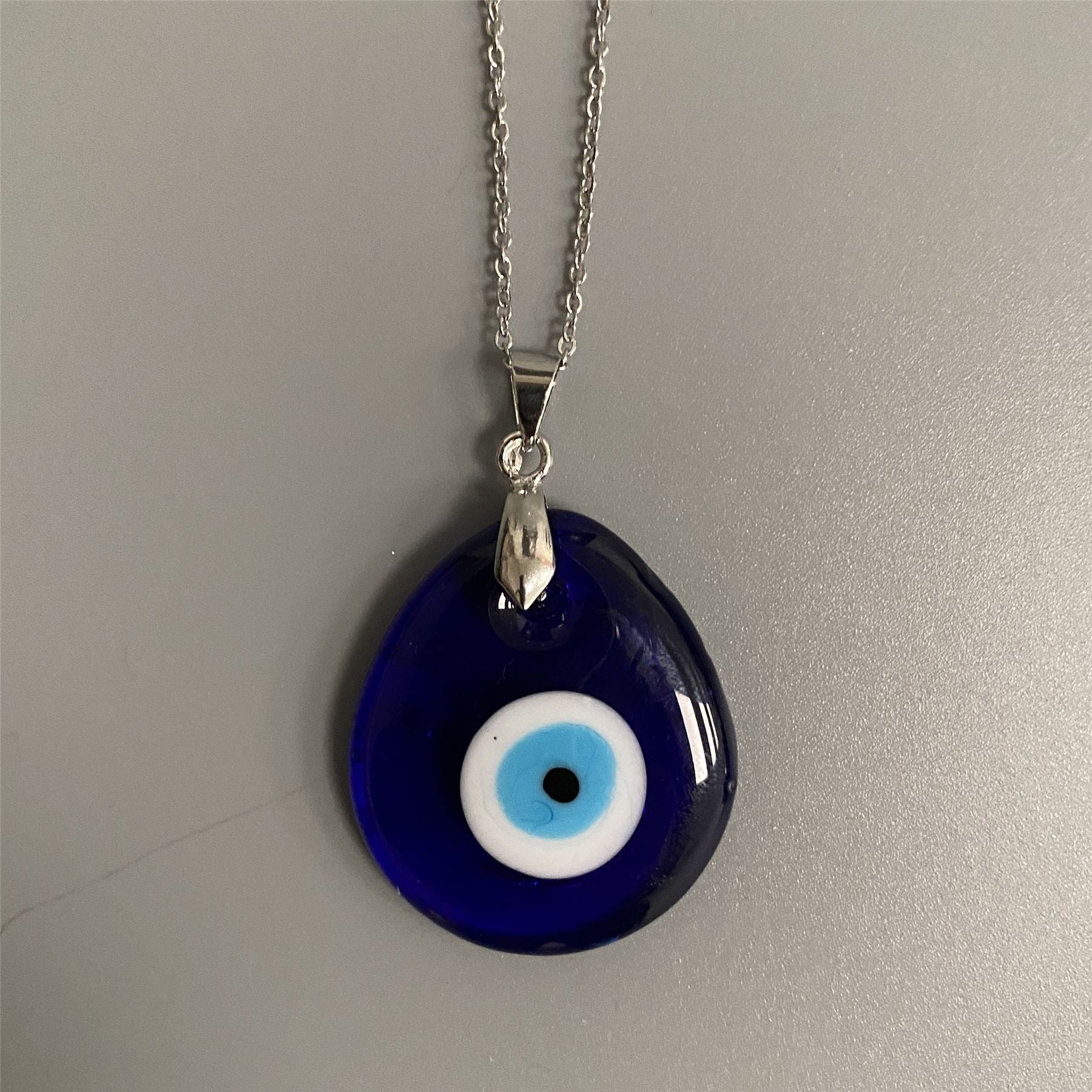 Elegant Evil Eye Pendant with Silver Chain in teardrop shape, symbolizing protection and good luck.