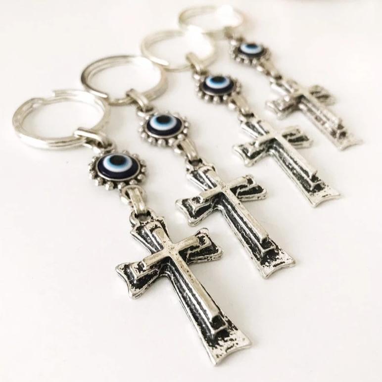 Handmade evil eye religious cross charm keyring featuring a blue evil eye and a cross design, perfect for keys or bags.