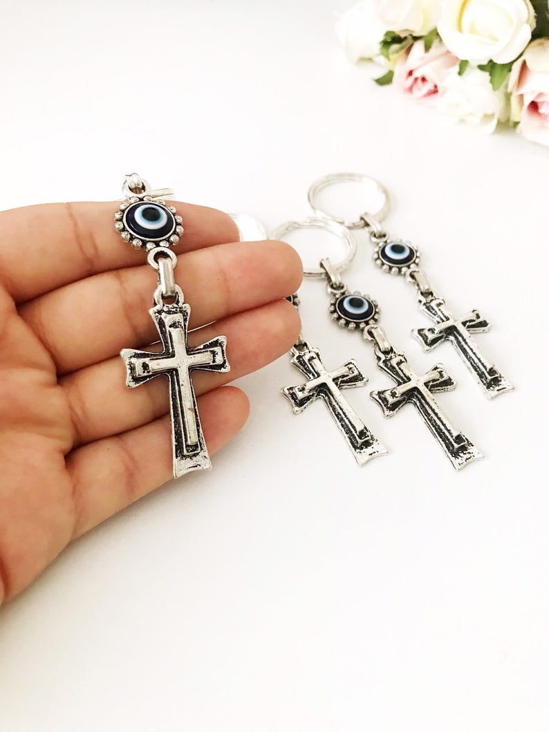 Handmade evil eye religious cross charm keyring featuring a blue evil eye and a cross design, perfect for keys or bags.