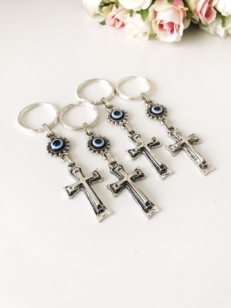 Handmade evil eye religious cross charm keyring featuring a blue evil eye and a cross design, perfect for keys or bags.