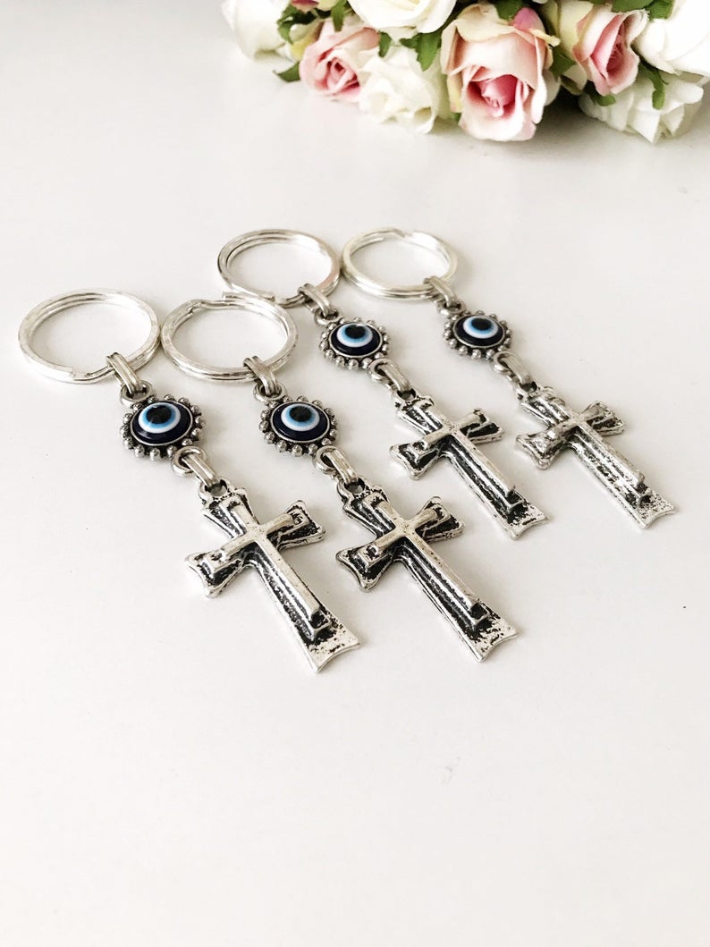 Handmade evil eye religious cross charm keyring featuring a blue evil eye and a cross design, perfect for keys or bags.