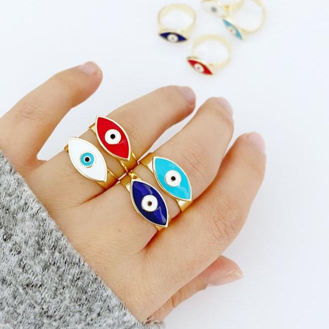 Adjustable Evil Eye Ring with gold band and colorful evil eye bead, available in blue, white, turquoise, and red.