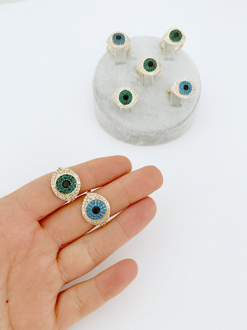 A beautiful gold Evil Eye Ring featuring a protective evil eye bead and sparkling zirconia stones, adjustable for all sizes.