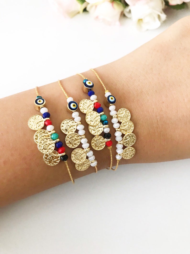 Evil Eye Seed Beads Bracelet featuring a gold chain and Turkish evil eye beads, elegantly designed for good luck and protection.