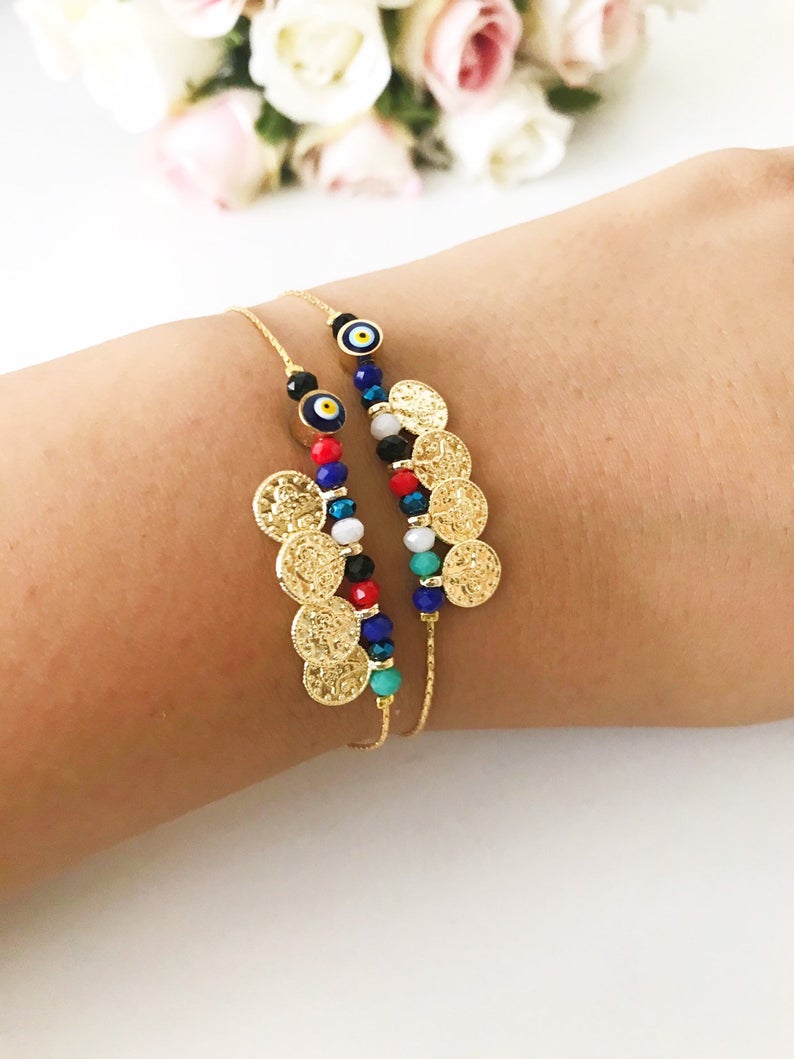 Evil Eye Seed Beads Bracelet featuring a gold chain and Turkish evil eye beads, elegantly designed for good luck and protection.