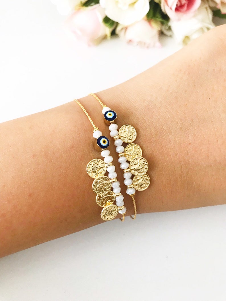 Evil Eye Seed Beads Bracelet featuring a gold chain and Turkish evil eye beads, elegantly designed for good luck and protection.