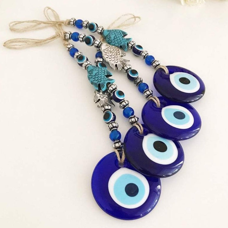 Handmade Evil Eye Wall Hanging featuring a fish lucky charm in silver and turquoise colors, measuring 27cm in length.