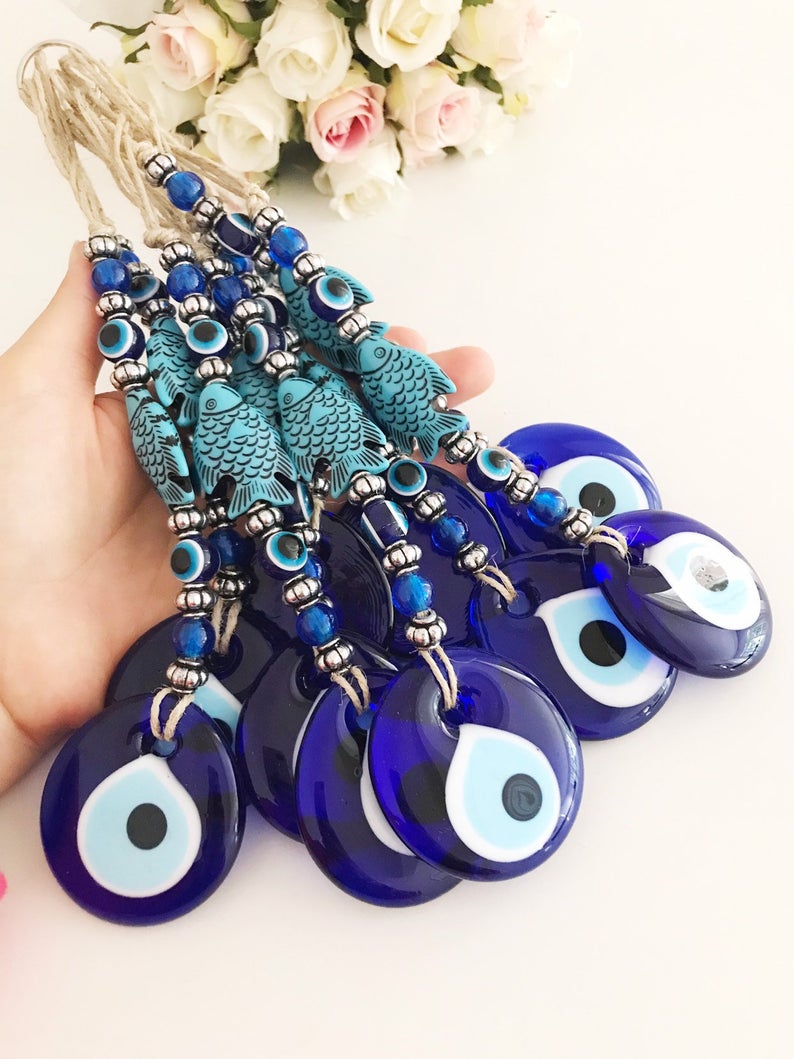 Handmade Evil Eye Wall Hanging featuring a fish lucky charm in silver and turquoise colors, measuring 27cm in length.