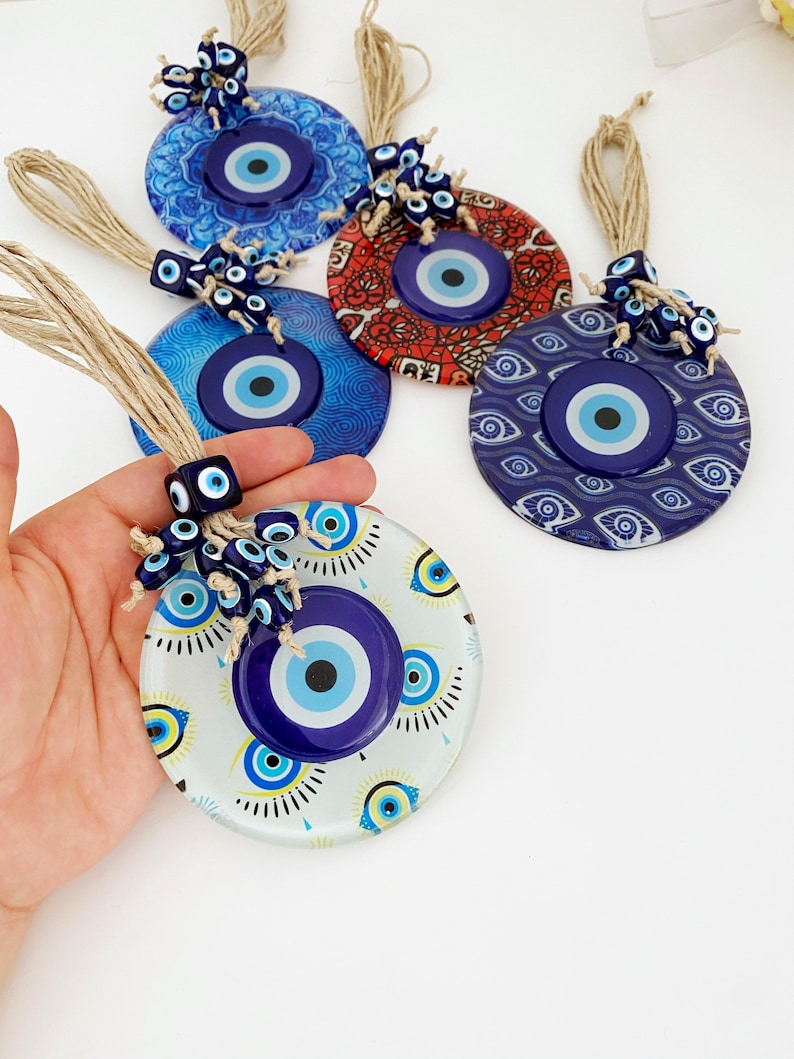 Handmade Evil Eye Wall Hanging featuring mosaic glass and evil eye beads, perfect for home decoration and protection.