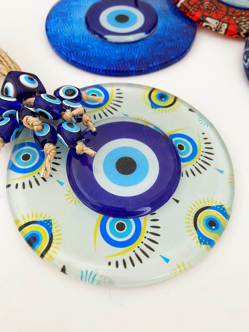 Handmade Evil Eye Wall Hanging featuring mosaic glass and evil eye beads, perfect for home decoration and protection.